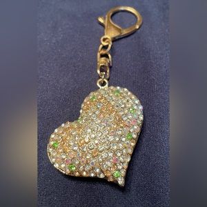 Puffed heart keychain/purse charm. Gold colored hardware with AB stones.